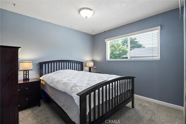 253 Gurnsey Dr, Red Bluff, CA 96080 - carpeted bedroom with baseboards and a textured ceiling