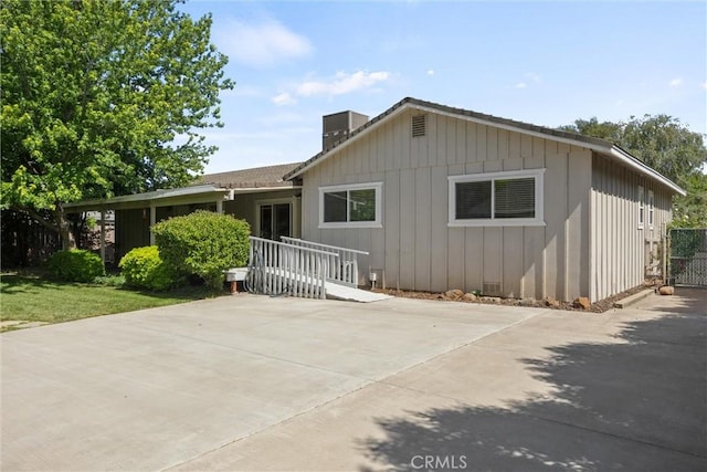253 Gurnsey Dr, Red Bluff, CA 96080 - view of front of house with a patio area and a chimney