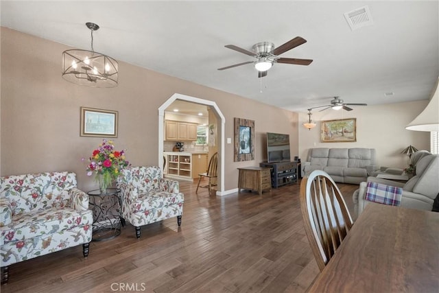 253 Gurnsey Dr, Red Bluff, CA 96080 - living area with a ceiling fan, wood finished floors, arched walkways, and a chandelier