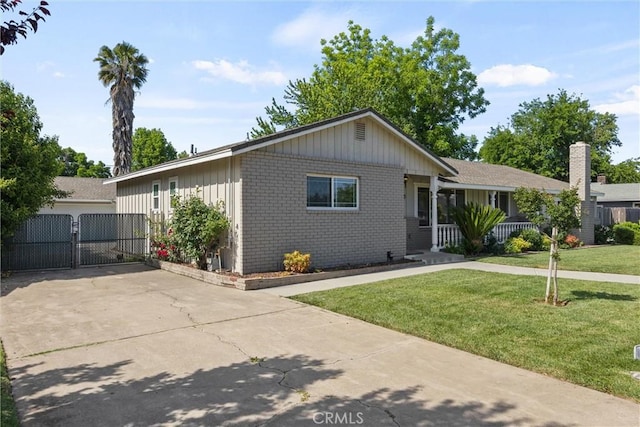 253 Gurnsey Dr, Red Bluff, CA 96080 - ranch-style home featuring brick siding, a gate, and a front lawn