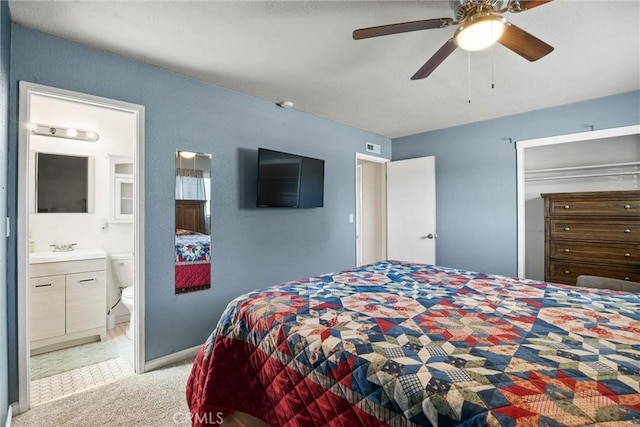 253 Gurnsey Dr, Red Bluff, CA 96080 - bedroom featuring light colored carpet, ensuite bathroom, baseboards, and ceiling fan