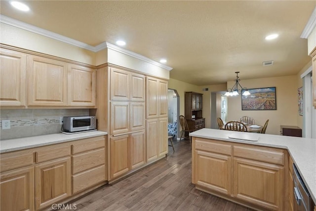 253 Gurnsey Dr, Red Bluff, CA 96080 - kitchen with light brown cabinetry, appliances with stainless steel finishes, light wood-style flooring, light countertops, and crown molding