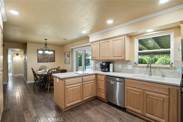253 Gurnsey Dr, Red Bluff, CA 96080 - kitchen with stainless steel dishwasher, a sink, a peninsula, light countertops, and a textured ceiling