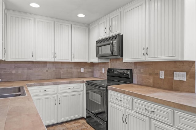 29131 Half Moon Trl, Pine Valley, CA 91962 - kitchen with black appliances, light countertops, white cabinetry, a sink, and backsplash