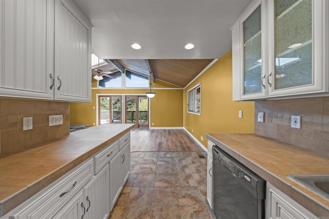 29131 Half Moon Trl, Pine Valley, CA 91962 - kitchen with dishwasher, tile countertops, baseboards, vaulted ceiling, and stone finish flooring