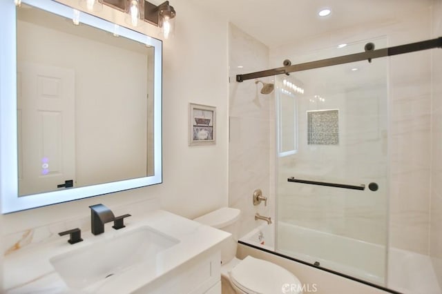 17041 Malta Cir, Huntington Beach, CA 92649 - bathroom with toilet, vanity, recessed lighting, and bath / shower combo with glass door