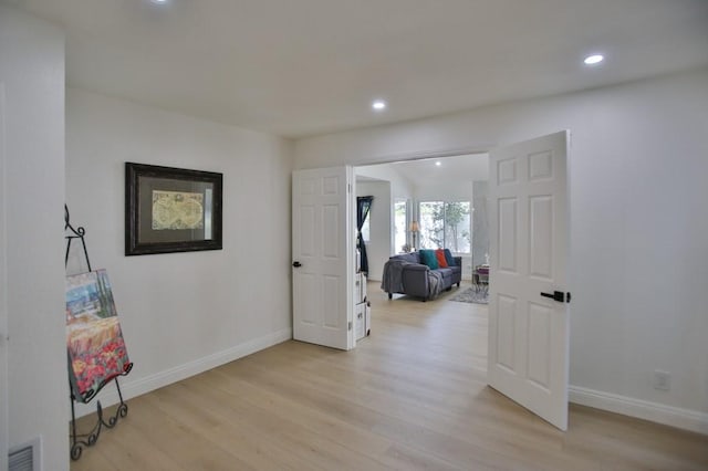17041 Malta Cir, Huntington Beach, CA 92649 - corridor with light wood-style flooring, baseboards, and recessed lighting