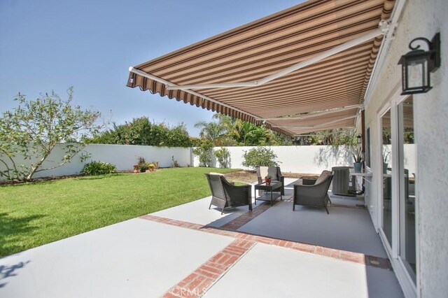 17041 Malta Cir, Huntington Beach, CA 92649 - view of patio featuring central AC and an outdoor living space