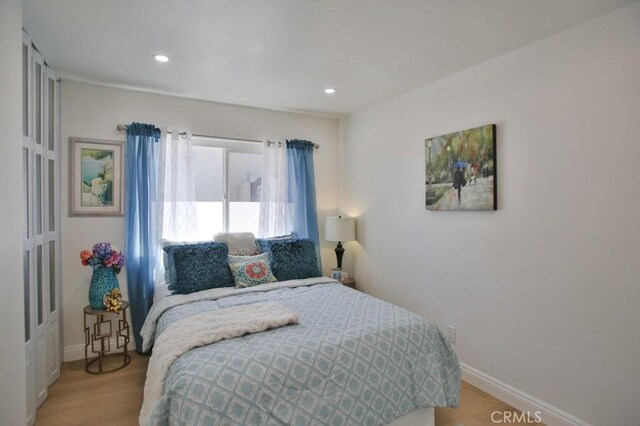17041 Malta Cir, Huntington Beach, CA 92649 - bedroom featuring baseboards, recessed lighting, and light wood-style floors