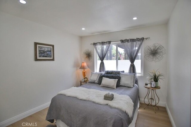 17041 Malta Cir, Huntington Beach, CA 92649 - bedroom with light wood finished floors, baseboards, and recessed lighting