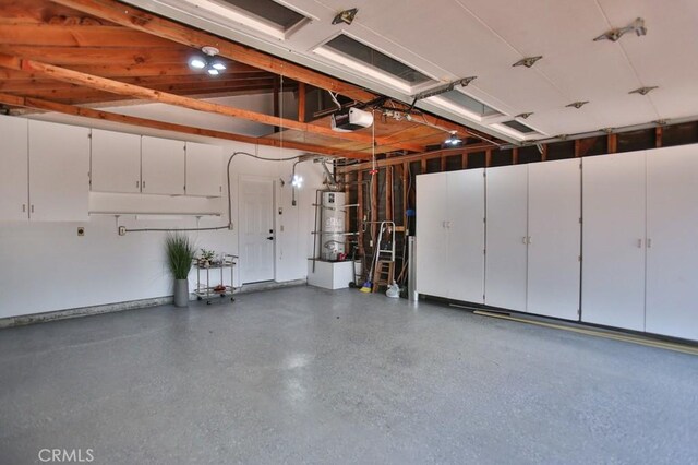 17041 Malta Cir, Huntington Beach, CA 92649 - garage with a garage door opener and strapped water heater