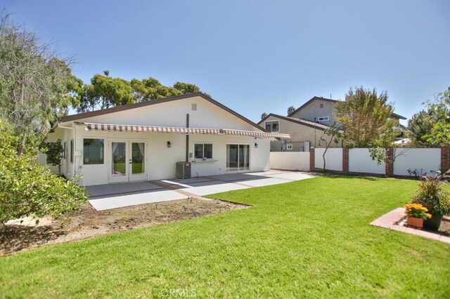 17041 Malta Cir, Huntington Beach, CA 92649 - back of house with french doors, a patio area, central AC unit, and stucco siding