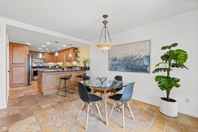 515 S Sierra Ave Unit 130, Solana Beach, CA 92075 - dining room featuring stone tile flooring, baseboards, and recessed lighting