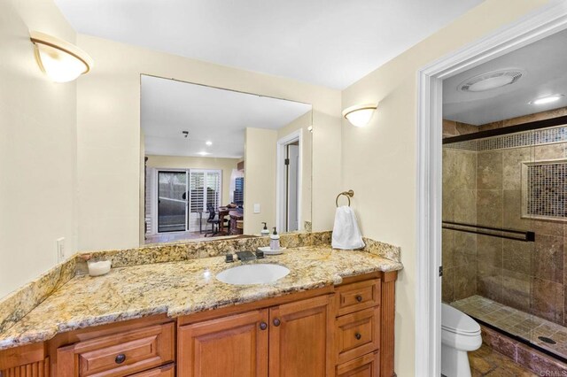 515 S Sierra Ave Unit 130, Solana Beach, CA 92075 - full bathroom featuring a stall shower, vanity, and toilet