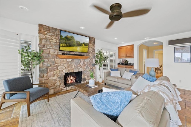 515 S Sierra Ave Unit 130, Solana Beach, CA 92075 - living room with a ceiling fan, a fireplace, healthy amount of natural light, arched walkways, and recessed lighting