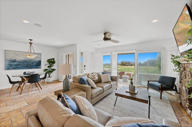 515 S Sierra Ave Unit 130, Solana Beach, CA 92075 - living area with stone tile flooring, baseboards, ceiling fan, and recessed lighting