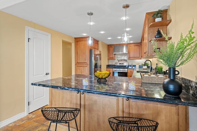 515 S Sierra Ave Unit 130, Solana Beach, CA 92075 - kitchen with appliances with stainless steel finishes, wall chimney exhaust hood, open shelves, a peninsula, and baseboards
