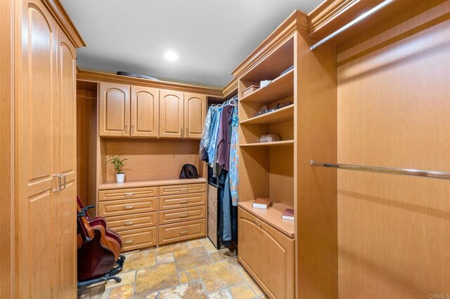 515 S Sierra Ave Unit 130, Solana Beach, CA 92075 - walk in closet with light stone finish floors
