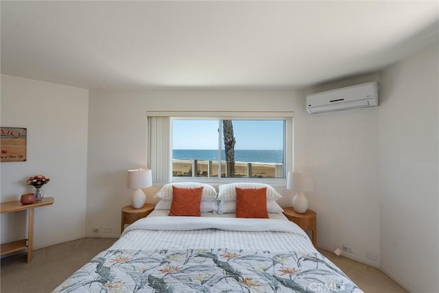 7335 Vista Del Mar Ln, Playa Del Rey, CA 90293 - bedroom featuring a wall mounted AC, light carpet, a water view, and baseboards
