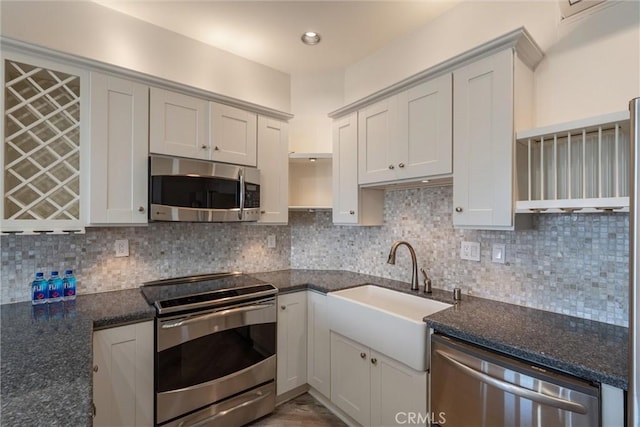 7335 Vista Del Mar Ln, Playa Del Rey, CA 90293 - kitchen featuring appliances with stainless steel finishes, a sink, open shelves, and tasteful backsplash