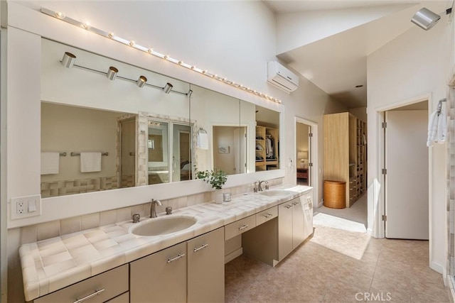 7335 Vista Del Mar Ln, Playa Del Rey, CA 90293 - bathroom featuring an AC wall unit, double vanity, and lofted ceiling
