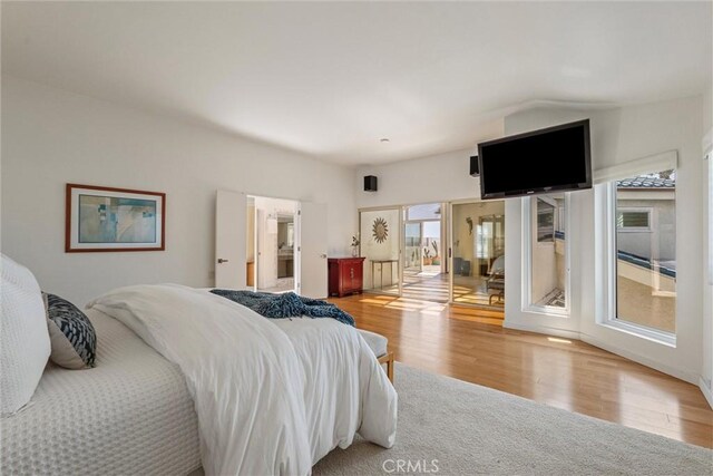 7335 Vista Del Mar Ln, Playa Del Rey, CA 90293 - bedroom featuring multiple windows and wood finished floors