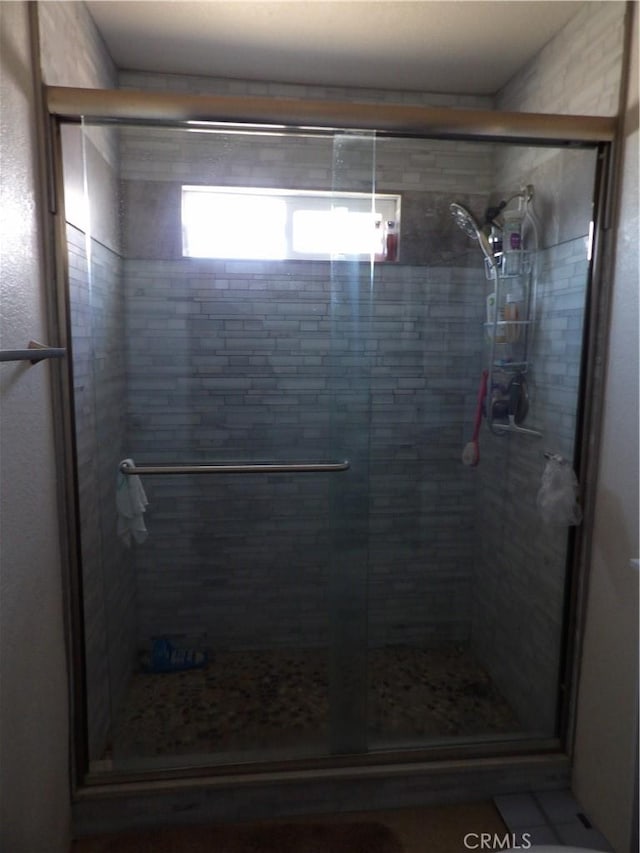 bathroom with a stall shower