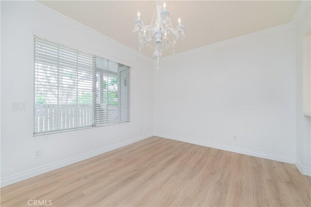 61 Greenfield Unit 68, Irvine, CA 92614 - unfurnished room featuring a chandelier, light wood finished floors, baseboards, and crown molding