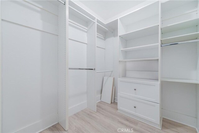 61 Greenfield Unit 68, Irvine, CA 92614 - spacious closet featuring light wood-style floors