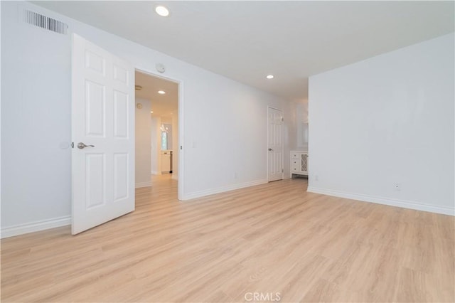 61 Greenfield Unit 68, Irvine, CA 92614 - spare room with light wood-style flooring, recessed lighting, and baseboards
