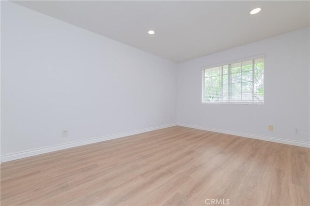 61 Greenfield Unit 68, Irvine, CA 92614 - empty room with light wood finished floors, baseboards, and recessed lighting