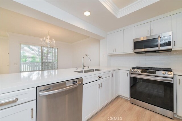 61 Greenfield Unit 68, Irvine, CA 92614 - kitchen with appliances with stainless steel finishes, ornamental molding, a sink, decorative backsplash, and light countertops