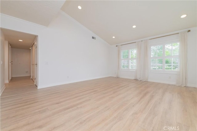 61 Greenfield Unit 68, Irvine, CA 92614 - empty room featuring light wood-type flooring, recessed lighting, baseboards, ornamental molding, and high vaulted ceiling