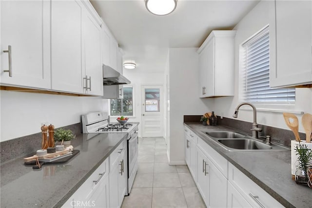 1510 E Idahome St, West Covina, CA 91791 - kitchen featuring white range with gas cooktop, wall chimney exhaust hood, a sink, white cabinets, and plenty of natural light