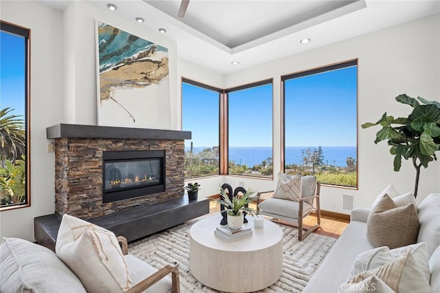 31532 Valido Rd, Laguna Beach, CA 92651 - living area featuring recessed lighting, a water view, a raised ceiling, wood finished floors, and a fireplace