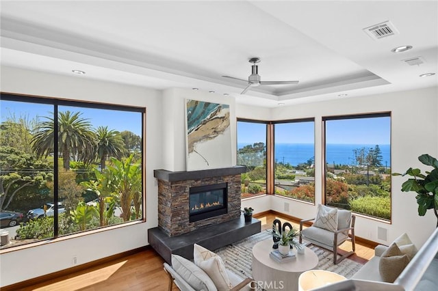 31532 Valido Rd, Laguna Beach, CA 92651 - living area featuring wood finished floors, a raised ceiling, a water view, healthy amount of natural light, and recessed lighting