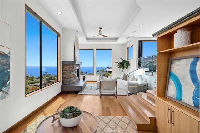 31532 Valido Rd, Laguna Beach, CA 92651 - living room featuring light wood-style flooring, a water view, a raised ceiling, a ceiling fan, and recessed lighting