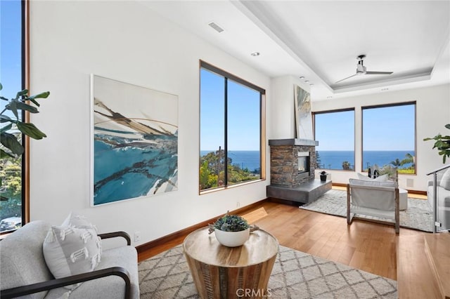 31532 Valido Rd, Laguna Beach, CA 92651 - living area featuring a water view, wood finished floors, plenty of natural light, and a ceiling fan