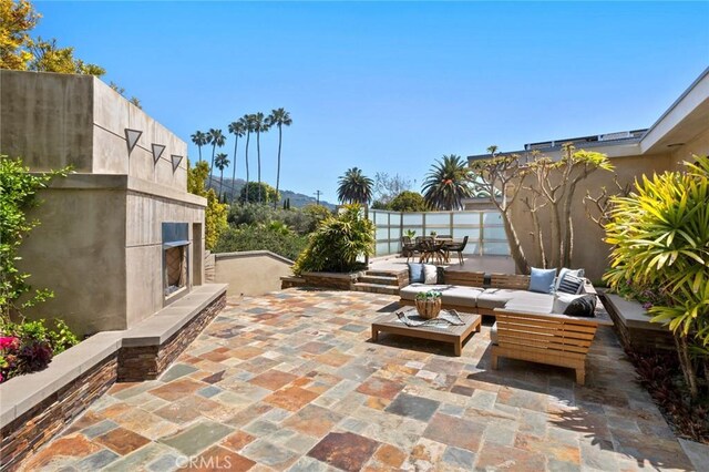 31532 Valido Rd, Laguna Beach, CA 92651 - view of patio with an outdoor living space with a fireplace and outdoor dining space