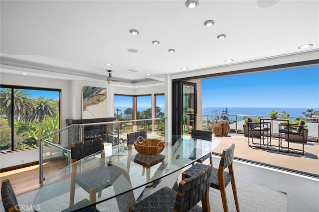 31532 Valido Rd, Laguna Beach, CA 92651 - dining room featuring recessed lighting, a glass covered fireplace, and a water view