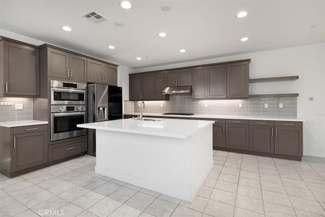 1901 Aliso Canyon Dr, Lake Forest, CA 92610 - kitchen featuring under cabinet range hood, a sink, decorative backsplash, stainless steel appliances, and light countertops