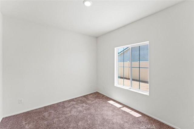 unfurnished room featuring carpet flooring, baseboards, and recessed lighting