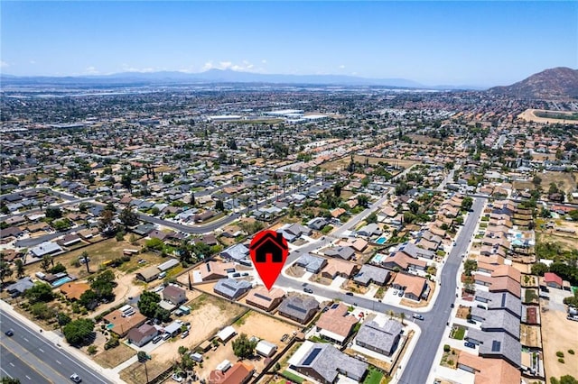 aerial overview of property's location featuring a mountainous background