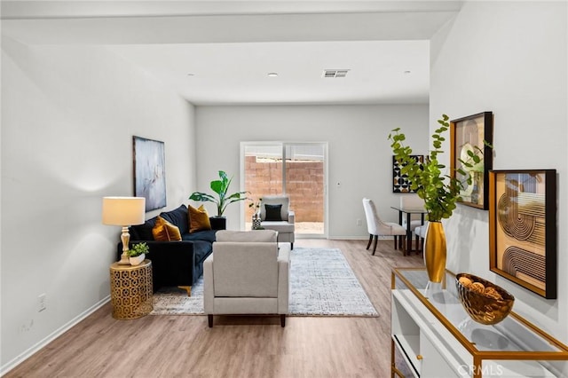 living area featuring wood finished floors and baseboards