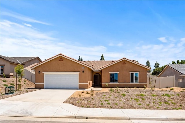 single story home with stucco siding, a garage, driveway, and a tiled roof