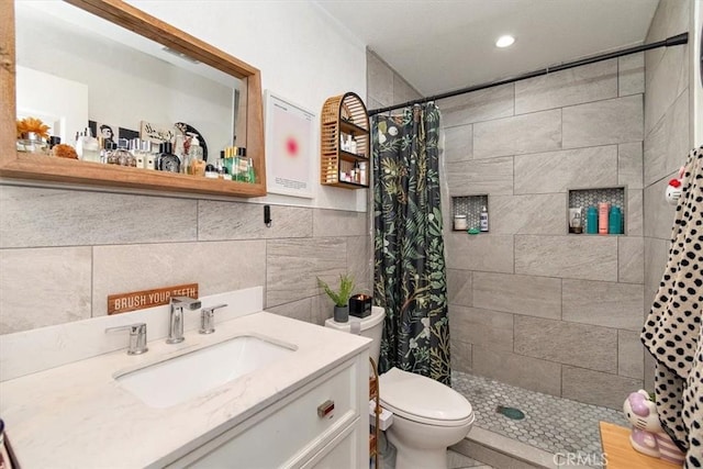 12113 Beverly Blvd Unit A, Whittier, CA 90601 - full bath with tiled shower, recessed lighting, vanity, toilet, and tile walls
