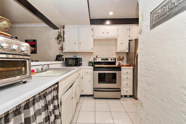 12113 Beverly Blvd Unit A, Whittier, CA 90601 - kitchen with stainless steel appliances, a sink, light tile patterned floors, light countertops, and white cabinetry