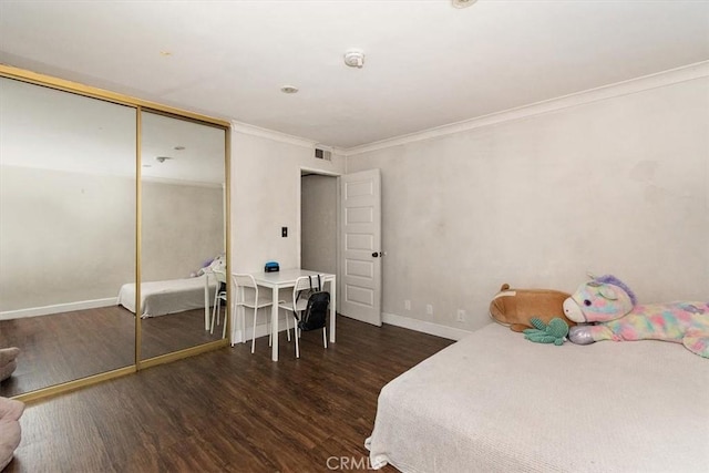 12113 Beverly Blvd Unit A, Whittier, CA 90601 - bedroom with wood finished floors, ornamental molding, baseboards, and a closet