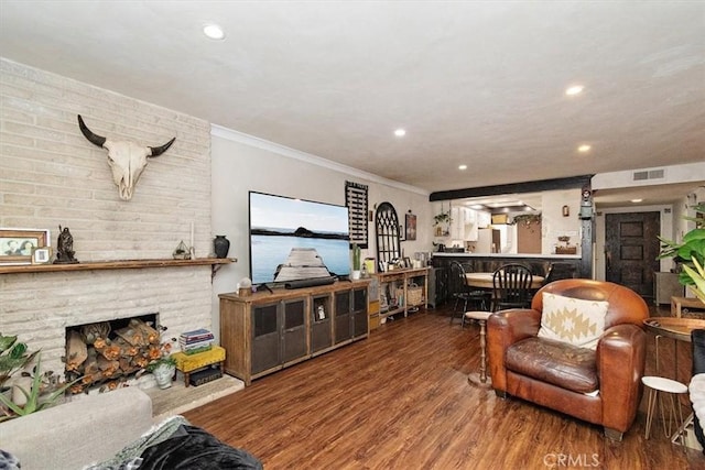 12113 Beverly Blvd Unit A, Whittier, CA 90601 - living area featuring wood finished floors, crown molding, recessed lighting, and a fireplace