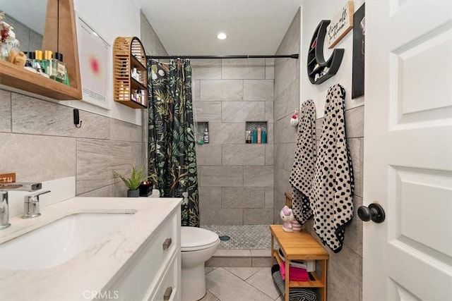 12113 Beverly Blvd Unit A, Whittier, CA 90601 - full bath with tiled shower, tile walls, vanity, toilet, and tile patterned floors